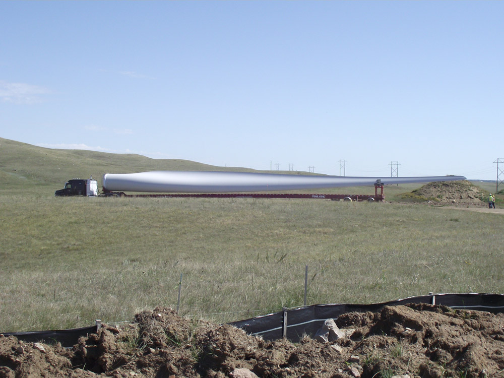 A blade is delivered to the construction site for the Bison Wind Energy Center.