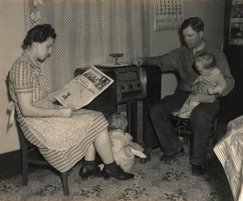Figure 56. This farm family enjoys listening to an electric radio