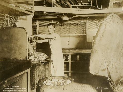 Sailor preparing meat for meals