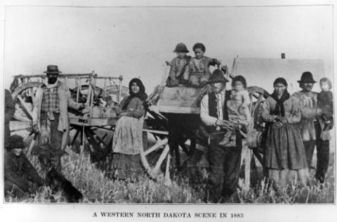 Metis Family and a Red River Ox Cart, circa 1883